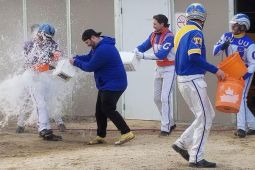 Tyson Jacoby gets the traditional 'first win treatment' from fellow horsemen on his return to the paddock. (Photo by Brittany Doyle)