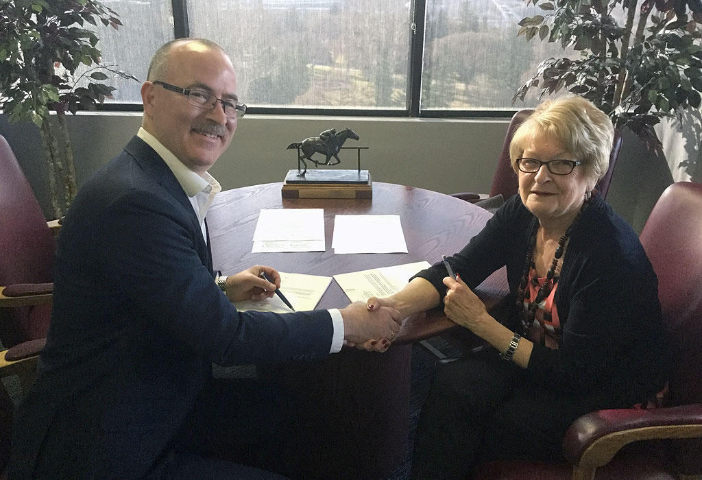 Kevin Gunderman and Shirley McClellan signing 2018 license extension
