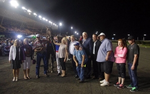 Dr. Maurice Stewart is seen holding on to Wrangler Magic and the Fan Hanover Trophy at Mohawk Racetrack on Saturday, June 20.