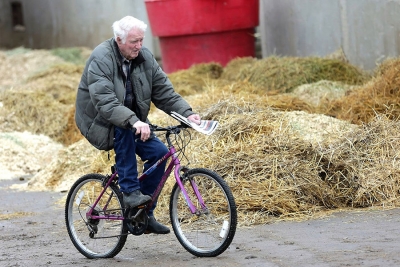 Red McKenzie on his bicycle