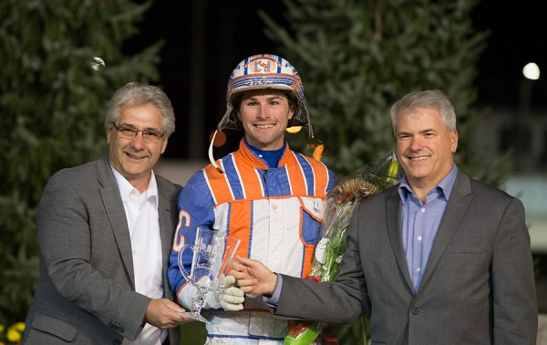 Dan Gall, President &amp; CEO of Standardbred Canada (L) and MIke Woods, Chief Operating Officer of Western Fair District congratulate 2016 National Driving Champion Brandon Campbell of Calgary, AB.