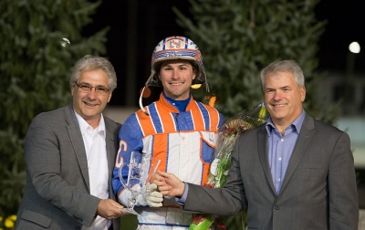 Dan Gall, President &amp; CEO of Standardbred Canada (L) and MIke Woods, Chief Operating Officer of Western Fair District congratulate 2016 National Driving Champion Brandon Campbell of Calgary, AB.