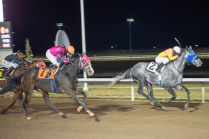 Jockey Renaldo Cumberbatch and Orange Theory leading in the Lynn Chouinard Distaff