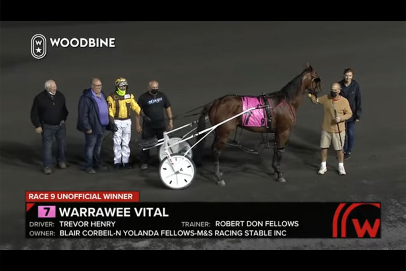 Warrawee Vital posing for a winner's circle photo, race 9, Oct 2, 2021 at Mohawk Raceway