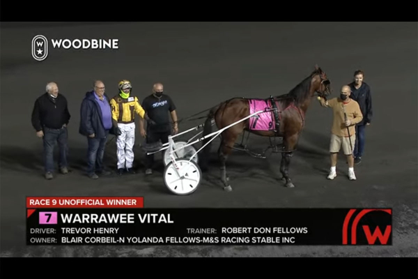 Warrawee Vital posing for a winner's circle photo, race 9, Oct 2, 2021 at Mohawk Raceway